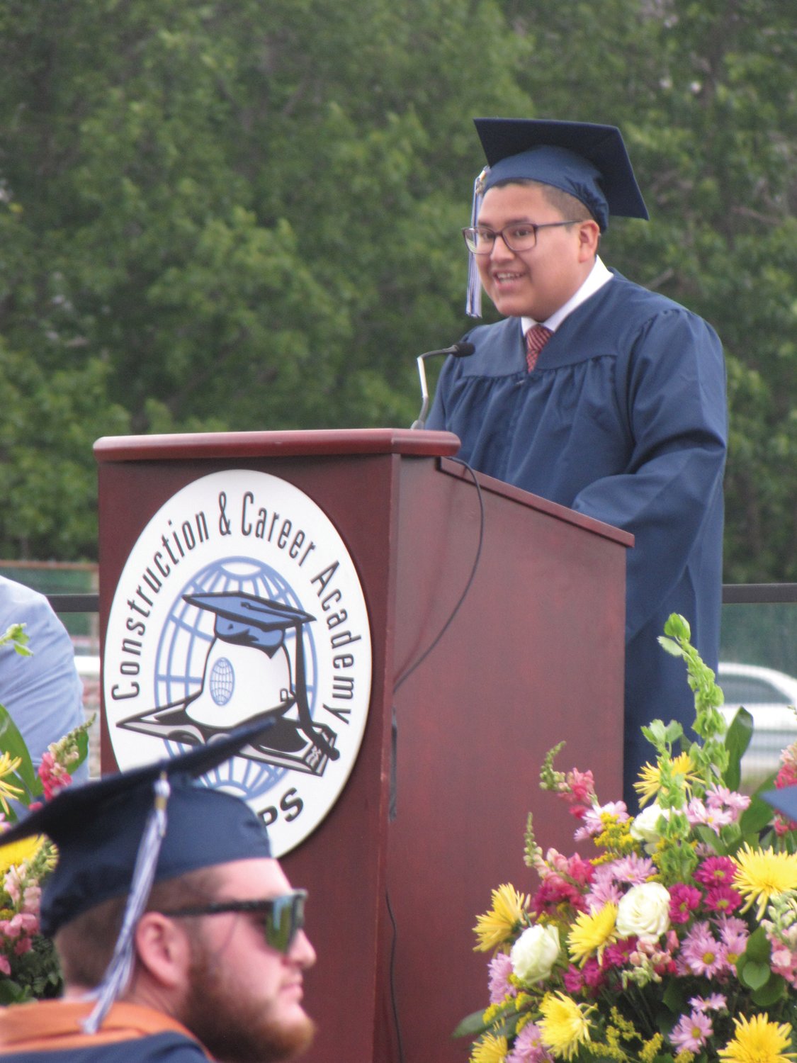 ‘GREAT HONOR’: Valedictorian Daniel Roca addresses his peers in the NEL/CPS class of 2021.